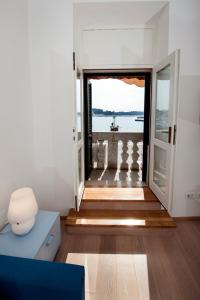 a living room with a view of the ocean at Apartment Al Porto in Rovinj