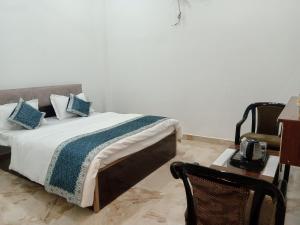 Katil atau katil-katil dalam bilik di RAVINDRA GEETA Inn