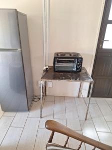 a toaster oven sitting on a table in a kitchen at Alhoa 4 in Gariep Dam +1 photo