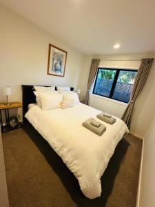 Postel nebo postele na pokoji v ubytování Modern Central Auckland + 4 fotografie