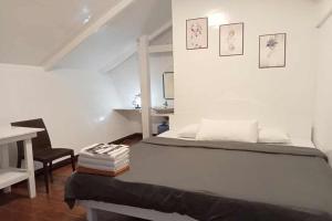 Ένα ή περισσότερα κρεβάτια σε δωμάτιο στο Mazawa Siargao