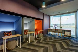 a room with a table and chairs and a window at Tru By Hilton Panama City Beach in Panama City Beach +83 photos