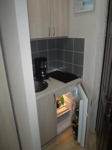 Cucina o angolo cottura di Garni Hotel Tri O