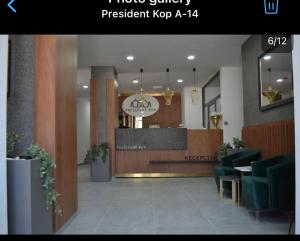 a lobby of a restaurant with a reception desk at A 14 President Kopaonik in Raška