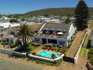 an aerial view of a house with a swimming pool at La Fontaine Guest House Hermanus in Hermanus