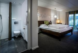 Voodi või voodid majutusasutuse Hotel Birksø toas