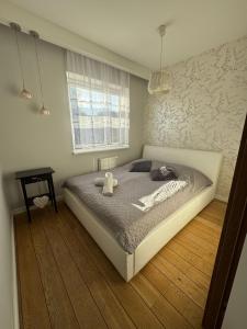Ένα ή περισσότερα κρεβάτια σε δωμάτιο στο Apartament Starowiejska