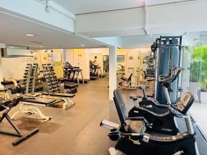 a gym with several treadmills and exercise bikes at Soha Homestay in Kuala Lumpur