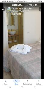 a bedroom with a bed with a sink and a mirror at B&B DieMme Amalfi Coast in Vietri sul Mare