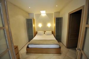 En eller flere senge i et værelse på La Bastide du Soleil