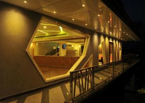 a staircase in a building with a large window at Hotel Rockdale in Visakhapatnam