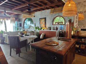 a kitchen with a island in the middle of a room at Beachfront Villa Tara Bliss Candidasa in Candidasa