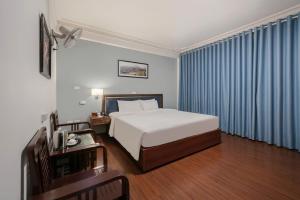 Ένα ή περισσότερα κρεβάτια σε δωμάτιο στο A25 Hotel - 45B Giảng Võ