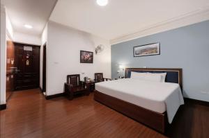 Ένα ή περισσότερα κρεβάτια σε δωμάτιο στο A25 Hotel - 45B Giảng Võ