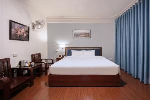 Ένα ή περισσότερα κρεβάτια σε δωμάτιο στο A25 Hotel - 45B Giảng Võ