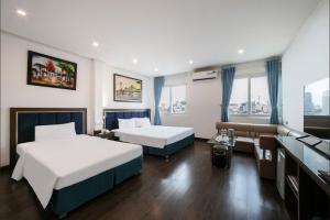 Ένα ή περισσότερα κρεβάτια σε δωμάτιο στο A25 Hotel - 45B Giảng Võ