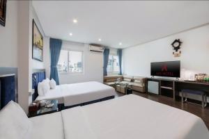 Ένα ή περισσότερα κρεβάτια σε δωμάτιο στο A25 Hotel - 45B Giảng Võ