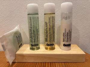 three thermometers sitting on a wooden shelf next to a wall at Luxury Suite - Amsterdam Lounge in Amsterdam