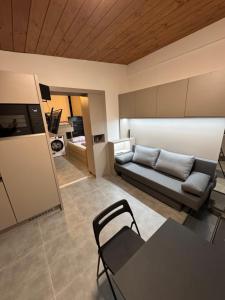 a living room with a couch and a table at Apartmán Rychvald in Rychwald
