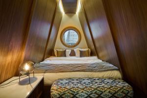 Letto o letti in una camera di F&B Spa Resort (ex. Fomich Hotel)