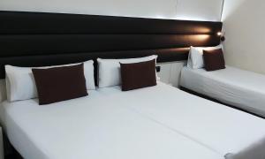 Postel nebo postele na pokoji v ubytování BCN Urbaness Hotels Del Comte