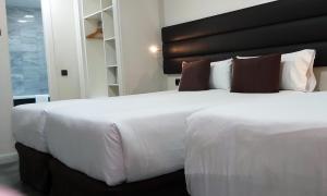 Postel nebo postele na pokoji v ubytování BCN Urbaness Hotels Del Comte