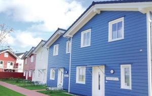 a row of colorful houses in a row at Nice Home In Dagebüll With Sauna in Dagebüll