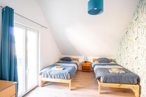 Ένα ή περισσότερα κρεβάτια σε δωμάτιο στο Gite la sellerie - 4 pers - 10 min Etretat