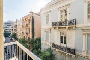 a view from a balcony of buildings at Honey Luxury Suite - close to Acropolis in Athens
