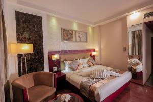 Postel nebo postele na pokoji v ubytování Bravura Gold Resort