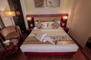 Postel nebo postele na pokoji v ubytování Bravura Gold Resort