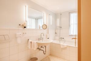 Koupelna v ubytování Hubertus Boutiquehotel Filzmoos + 37 fotografií
