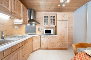 Kuchyň nebo kuchyňský kout v ubytování Tié No Appartement Chaleureux