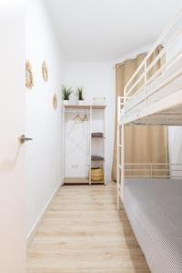 Posteľ alebo postele v izbe v ubytovaní Apartamento NUEVO con encanto en SAGRADA FAMILIA