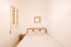 Posteľ alebo postele v izbe v ubytovaní Apartamento NUEVO con encanto en SAGRADA FAMILIA