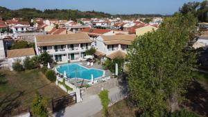 an aerial view of a house with a swimming pool at Toni´s Guesthouse in Kavos