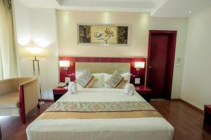 Postel nebo postele na pokoji v ubytování Bravura Gold Resort
