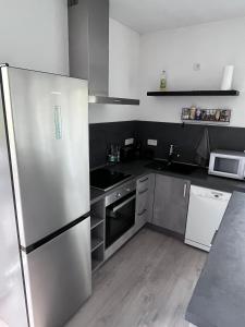 Η κουζίνα ή μικρή κουζίνα στο Forststrasse Apartment