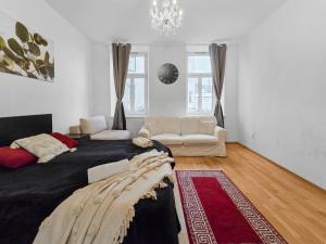 a living room with a large bed and a couch at Three-Bedroom Sanctuary, King-Size Beds in Vienna