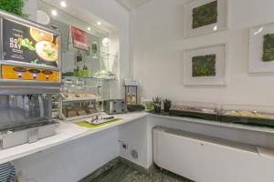 Kuchyň nebo kuchyňský kout v ubytování Hotel Boomerang Roma