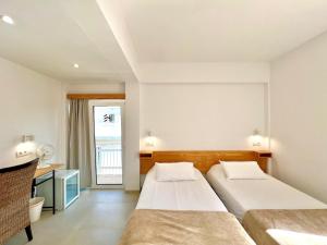 Postel nebo postele na pokoji v ubytování Hotel Edén