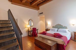 Postel nebo postele na pokoji v ubytování Hotel Machiavelli Palace