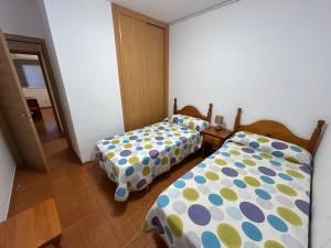 Postel nebo postele na pokoji v ubytování Faro de Mar + 20 fotografií