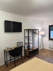 TV a/nebo společenská místnost v ubytování Gasthaus Zum Alten Euler