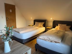 Postel nebo postele na pokoji v ubytování Gasthaus Zum Alten Euler