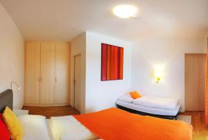 Postel nebo postele na pokoji v ubytování Hotel Gästehaus Neubauer