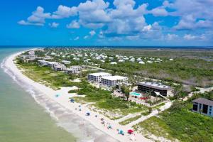 an aerial view of a resort on the beach at Pine Cove #202 in Ybel