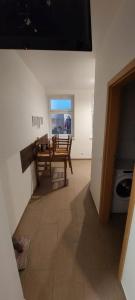 a living room with a bench and a table at Monteurwohnungen in Wanzleben in Wanzleben +11 photos