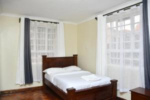 Ένα ή περισσότερα κρεβάτια σε δωμάτιο στο Melrose Homestay & Garden