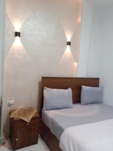 Letto o letti in una camera di Pyramids Home Guest House